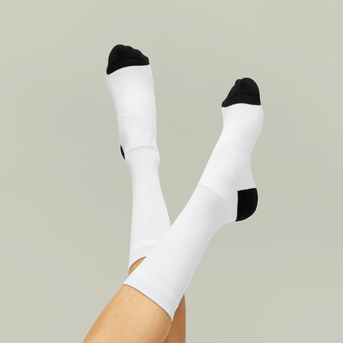 Supplier photograph of unprinted white crew socks with black toes and heels